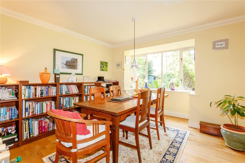 The separate dining room is generous in size, providing plenty of space for family and entertaining, and is bathed in light from the bay windows which offer views of the grounds.