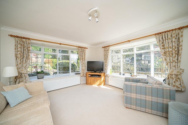 Bright and spacious, the modern sitting room provides a snug area to relax, with views looking out towards the river.