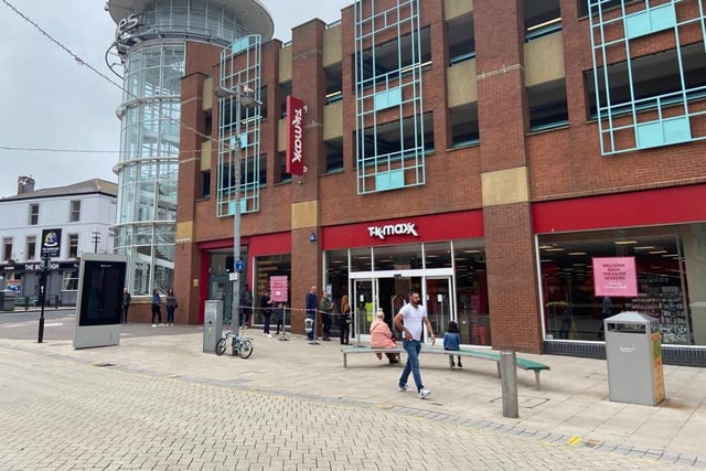A small number of people wait outside TK Maxx in Sunderland on Tuesday.