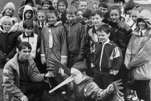 Pupils from Mortimer Comprehensive School visited the RSPB educational scheme at Marsden in 1991. RSPB teacher-naturalist Steve Allen is pictured front and Sid Gulbrandsen is with the children.  Pupil Mark Stephenson is dressed up. Can you tell us more about the photo?