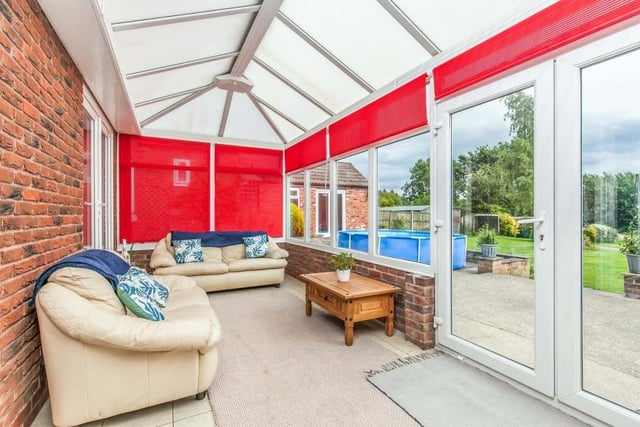 Cosy and comfortable are the words that spring to mind when stepping into the conservatory. Made of brick and uPVC, it has a ceramic tiled floor, while double-glazed French windows lead into the back garden.