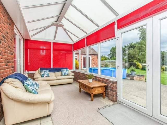 Cosy and comfortable are the words that spring to mind when stepping into the conservatory. Made of brick and uPVC, it has a ceramic tiled floor, while double-glazed French windows lead into the back garden.