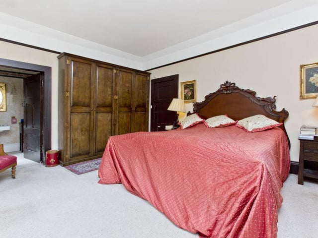 The master suite is turreted and boasts a luxurious four-piece en-suite bathroom with balcony access.