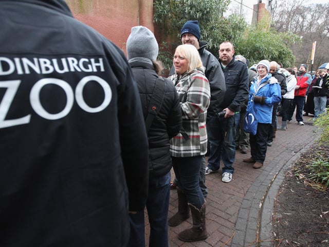 Members of the public queue to view the panda bears at Edinburgh Zoo on December 16, 2011 in Edinburgh, Scotland. The eight-year-old pair of giant pandas arrived on a specially chartered flight from China over a week ago and are the first to live in the UK for 17 years. Edinburgh zoo are hopeful that the pandas will give birth to cubs during their stay in Scotland.