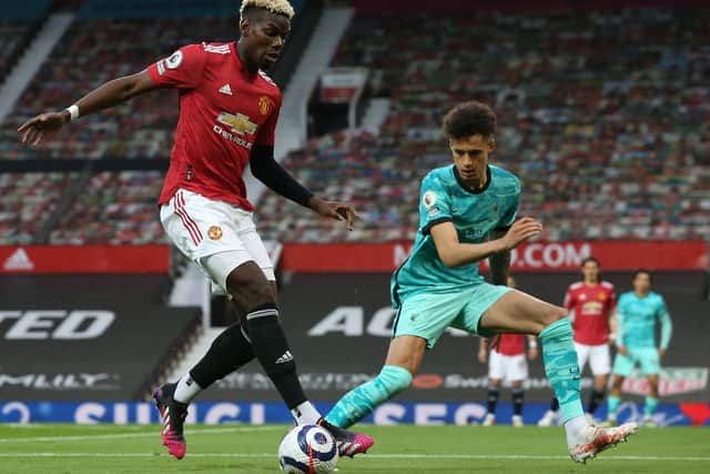 Paul Pogba of Manchester United in action with Rhys Williams of Liverpool (Matthew Peters/Manchester United via Getty Images)
