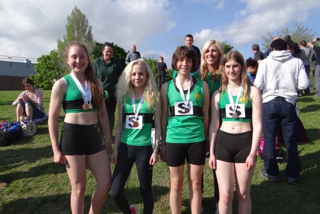 A former Worksop Harriers Under 15 girls relay team, and Amy Fendley, coach and long jump champion