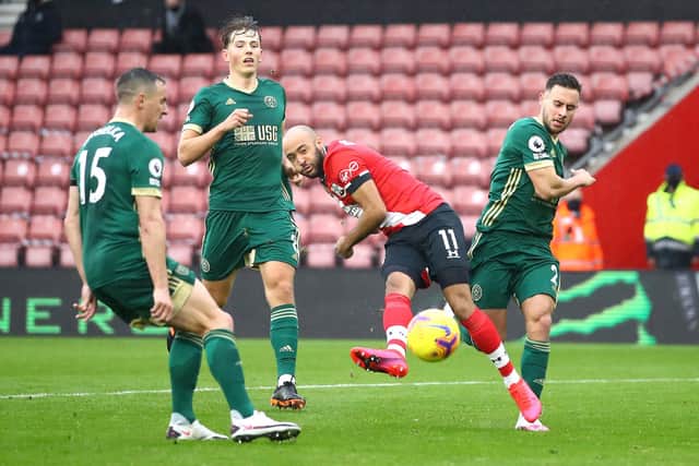 Southampton's Nathan Redmond (centre) scores his side's third goal of the game during the Premier League match at St Mary's Stadium, Southampton. Michael Steele/PA Wire.