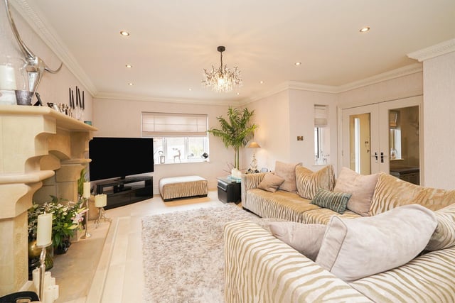 The open plan space curves all the way round the house, from the snug in the back to this lounge area at the front of the house. It's large and bright, perfect for relaxing and watching a film,