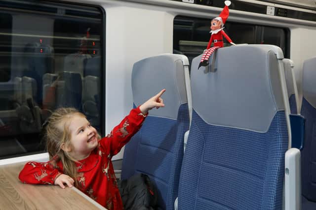 Three-year-old Indiana Shaw couldn’t hide her delight at seeing the cheeky elves. Picture by Jason Lock