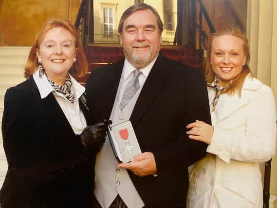 Steve Smith receiving MBE with wife Jennifer Smith and daughter Rebecca Smith-Bains