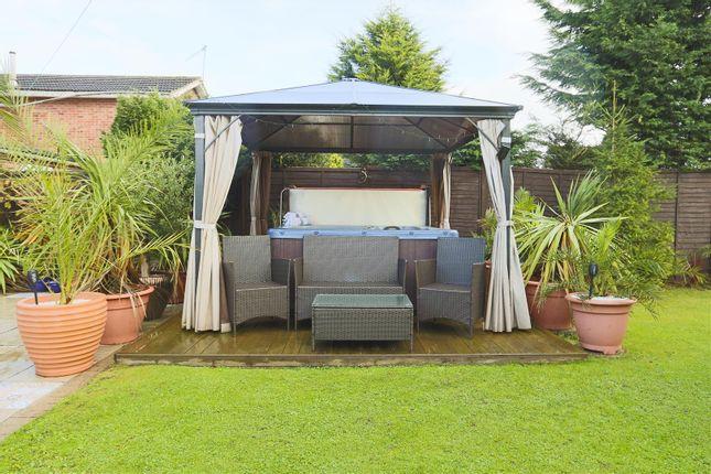 The drapes, plants and decking give the hot tub at this three-bedroom detached house, the look of a desert oasis. Guide price: £230,000