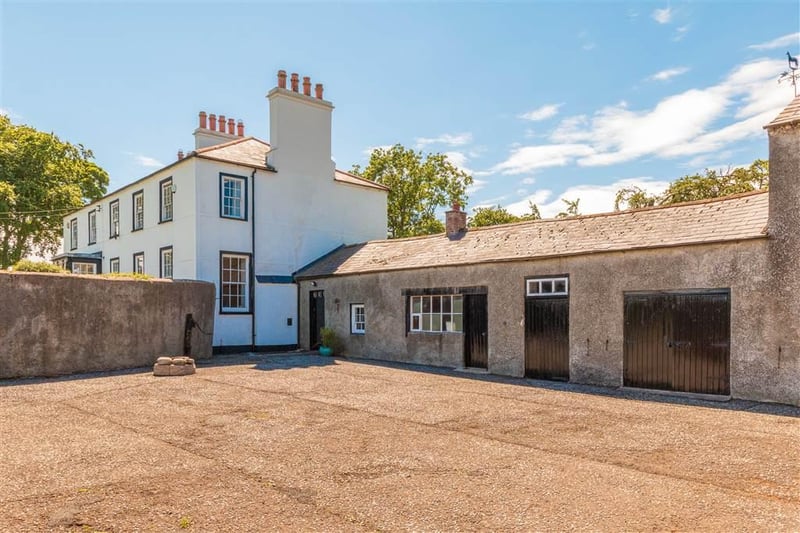 The property is complemented by a range of stone outbuildings.