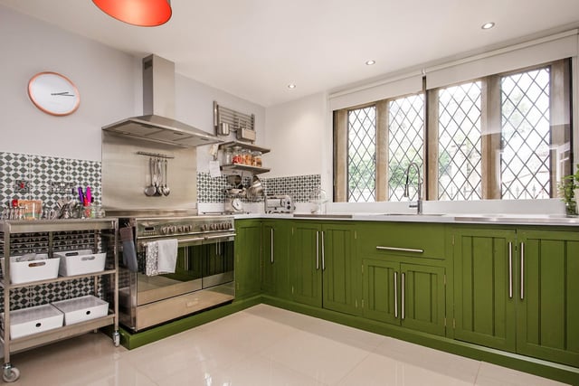 The kitchen features a range of hand-built solid pine units, a polished stainless steel sink, a Kenwood electric range and porcelain floor tiles. The original stone mullioned windows provide views towards All Saints Church in Bakewell.