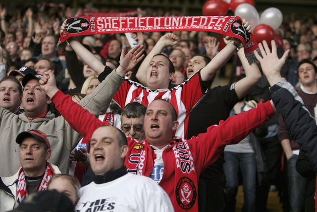 A Blades fan celebrates his team's promotion to the top flight during the Coca Cola Championship clash against Yorkshire rivals Leeds United at Bramall Lane in April 2006.