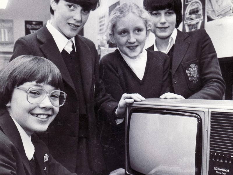 Computers were presented to, from left, Clare Kelly 13, Sarah Burke 12, Rachel Cook 13 and  Gillian Smith 13, after winning an anti shop lifting competition at Notre Dame School organised by Sheffield and District Chamber of Trade, December 19, 1983