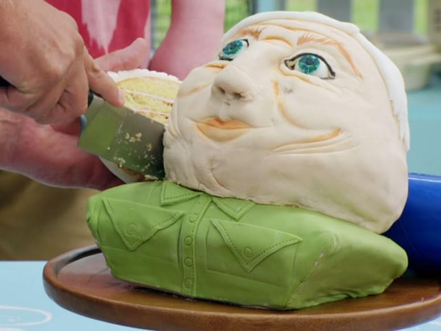 Sura’s David Attenborough cake bust was an ambitious bake, but unfortunately for the baker the cake head of the naturalist wouldn’t stand up straight and had to be propped with a roll of piping bags (Photo: Channel 4/Getty)
