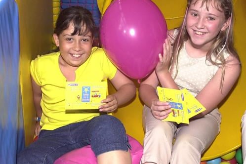 Laura Walker and Charlotte D'Rozario in a fun bus in 2001 as part of the Summer Fun Campaign.
