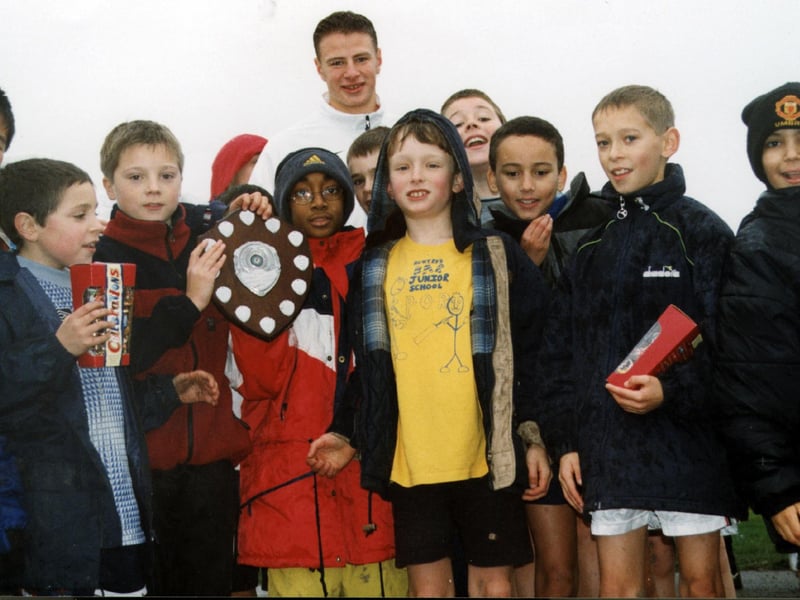 Gerard Plunkett with Hunters Bar school pupils who are the Sheffield Primary School league leaders, December 27, 1999
