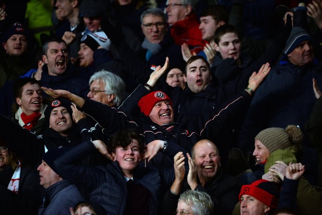 Jubilant United supporters celebrate a goal against Derby County at Pride Park on New Year's Day 2018.