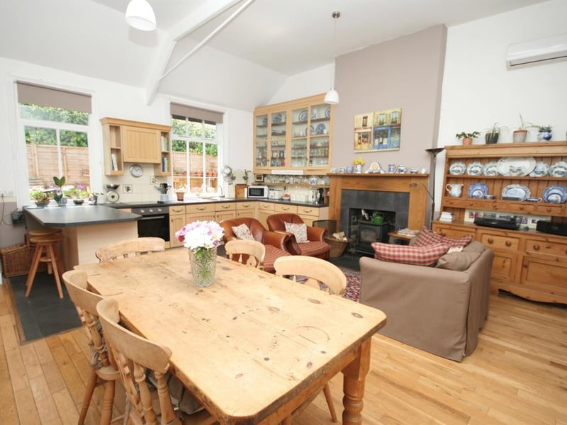 Fitted with wall and base units with roll top work surfaces over, stainless steel sink and drainer, tiled splashbacks, integrated electric oven and four ring electric hob with extractor fan over, integrated fridge, integrated freezer, integrated dishwasher.
