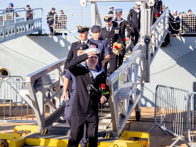 Crew members stepping off HMS Diamond. Picture: Habibur Rahman