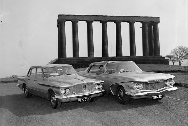 Two American cars - a Plymouth Valiant and a Plymouth Fury - on Calton Hill as part of a promotion by the Chrysler Corporation in March 1960.