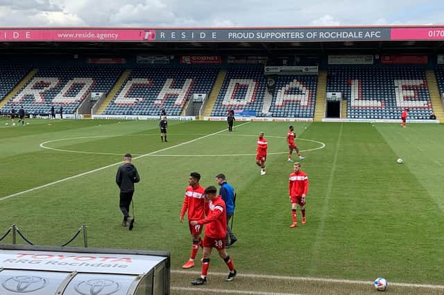 The Rovers squad leaves the field after the warm-up at Rochdale