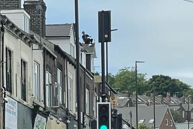 A man who spent more than 12 hours on top of a roof on Chesterfield Road in Heeley, Sheffield, has come down safely, police have confirmed (photo by Steve Colton)