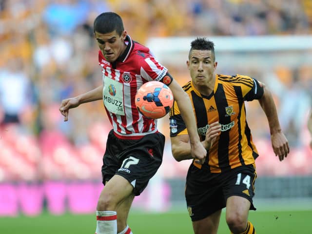 Conor Coady of Sheffield United and Jake Livermore of Hull City battle for the ball in the FA Cup semi-final at Wembley. Pic : Martyn Harrison