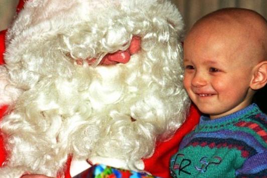 A photo from the 1990s of a young boy visiting Santa - from the Free Press photo archive.