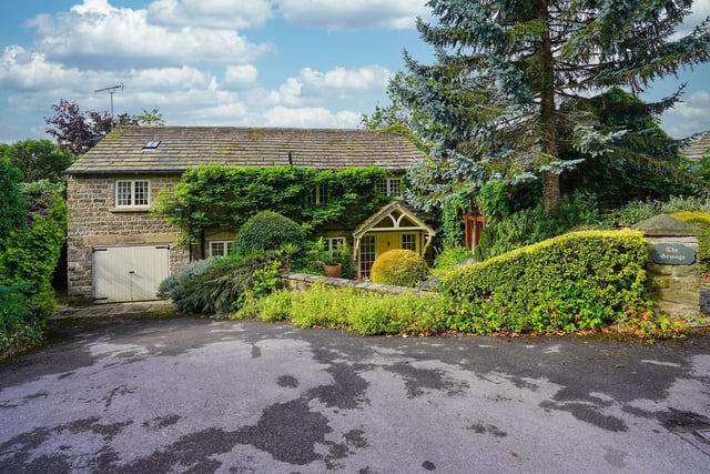 This property has a guide price of an enormous £1.55million, but comes with incredible, expansive gardens and a full size tennis court.
