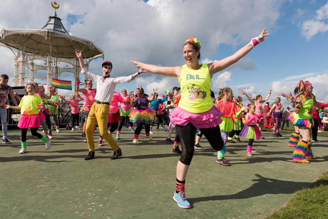 Portsmouth Pride returns for another year to help raise awareness of the LGBTQ+ community. The parade  started at South Parade Pier and finished up at the bandstand for an afternoon of live music and entertainment. Dancing with 'Fit 'n Funky'. Picture: Duncan Shepherd
