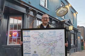 Steve Lovell with his London Underground-style map of Sheffield's pubs outside The Washington on Fitzwilliam Street in Sheffield city centre
