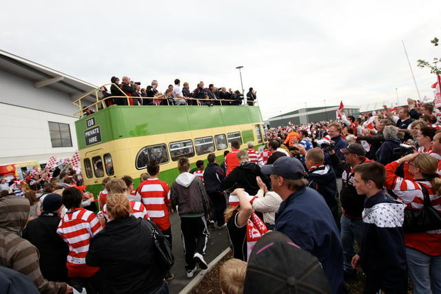 Rovers fans wave off the players on the open top bus