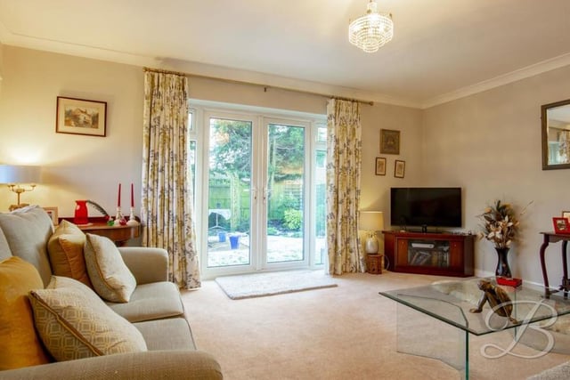 The lovely, well-presented lounge is an ideal place to relax after a hard day's work. Neutrally decorated and with a carpeted floor, its French doors lead nicely out into the garden.
