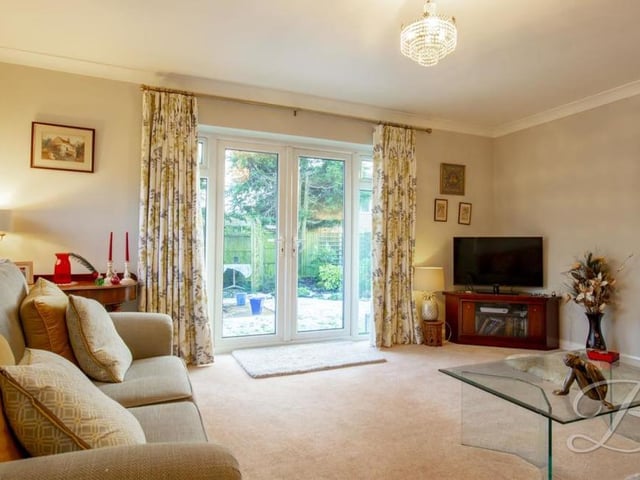 The lovely, well-presented lounge is an ideal place to relax after a hard day's work. Neutrally decorated and with a carpeted floor, its French doors lead nicely out into the garden.
