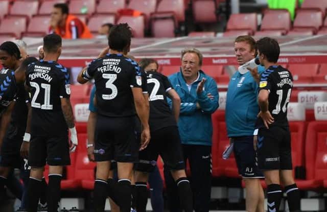 Neil Warnock talks to his players during Middlesbrough's win over Stoke City.