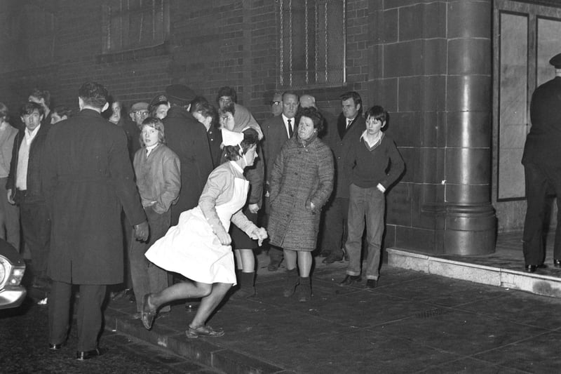 Ibrox Disaster - a nurse dashes into Ibrox stadium, home of Rangers FC, after the collapse of stairway 13 on the 2nd January 1971. 