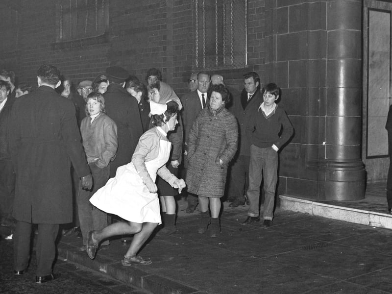 Ibrox Disaster - a nurse dashes into Ibrox stadium, home of Rangers FC, after the collapse of stairway 13 on the 2nd January 1971.