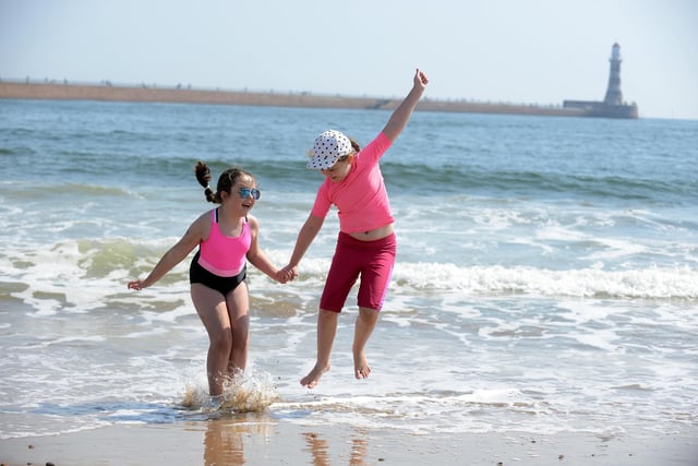 Youngsters Eve Eccleston, eight, and Orla Tuthill, seven, cool off at Roker Beach.