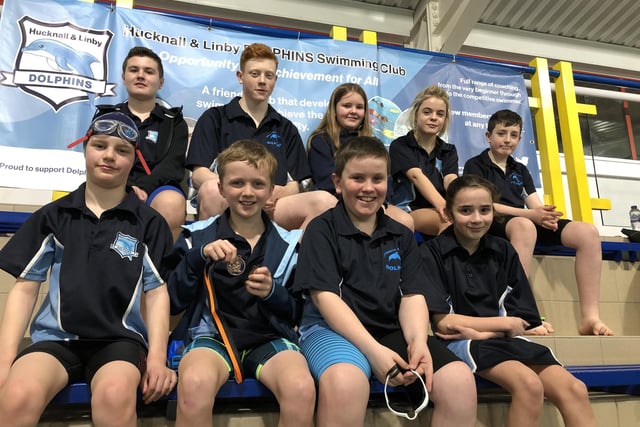 The Hucknall and Linby Dolphins squad gather at a swimming meet.