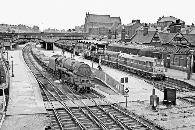 Trains can be seen at Rotherham Masborough in June 1966. The station closed in 1988.
