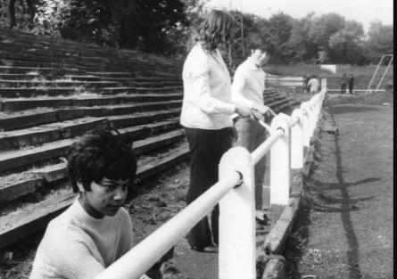 Jeanette Ali, 14, of Trinity House Youth Club, pictured with some colleagues painting the rail around the Simonside Hall pitch in 1963.