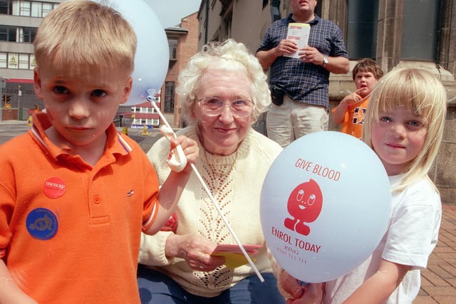 Joyce Capper with grandchildren Frances and Callum Watson  watched the parade in 1999