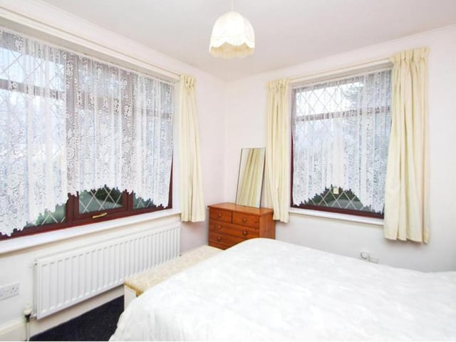 Windows to the side and back make the second bedroom particularly light and bright. It is as cosy as the rest of the Stretton bungalow.