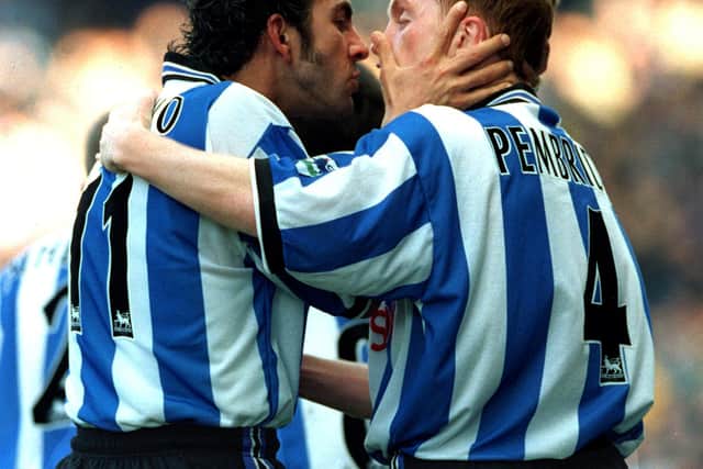 Who loves you baby! Paolo Di Canio gets close to Sheffield Wednesday team-mate Mark Pembridge