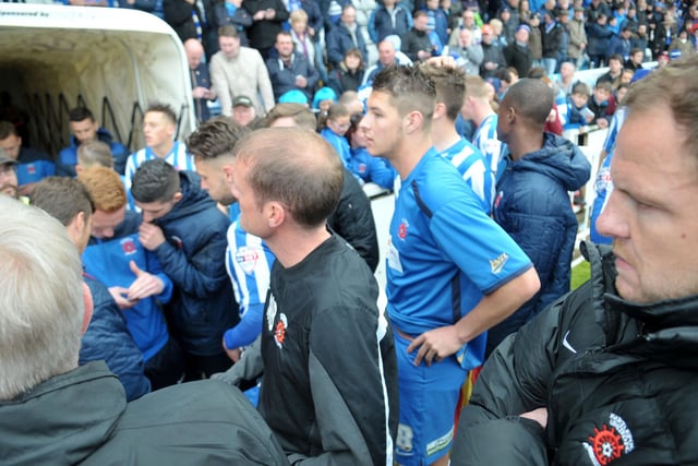 Hartlepool United players await the final results from other games to see if their 2-1 over Exeter City has seen them maintain their Football League status. Picture by FRANK REID