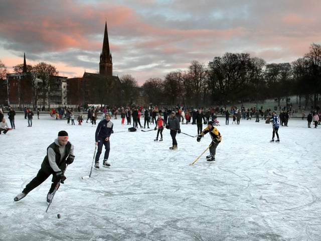 People play ice hockey as the sun sets on a frozen pond in Queen's Park, Glasgow. Picture Andrew Milligan/PA Wire
