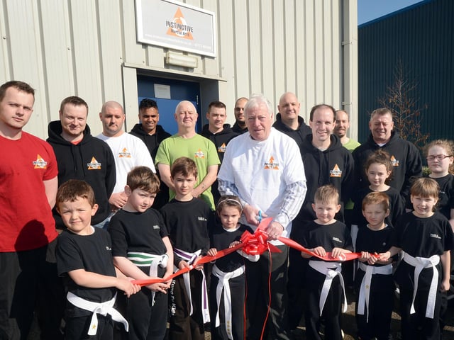 Mansfield's Executive Mayor Tony Egginton, cut the ribbon to officially open the new premises for Instinctive Martial Arts and Fitness Academy back in 2013 with owner Steve Hodgkinson and club members at their new home on the Millenium Business Park in Mansfield