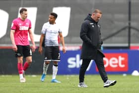 Wayne Rooney is managing his Derby County side with a lot of noise going on around him.